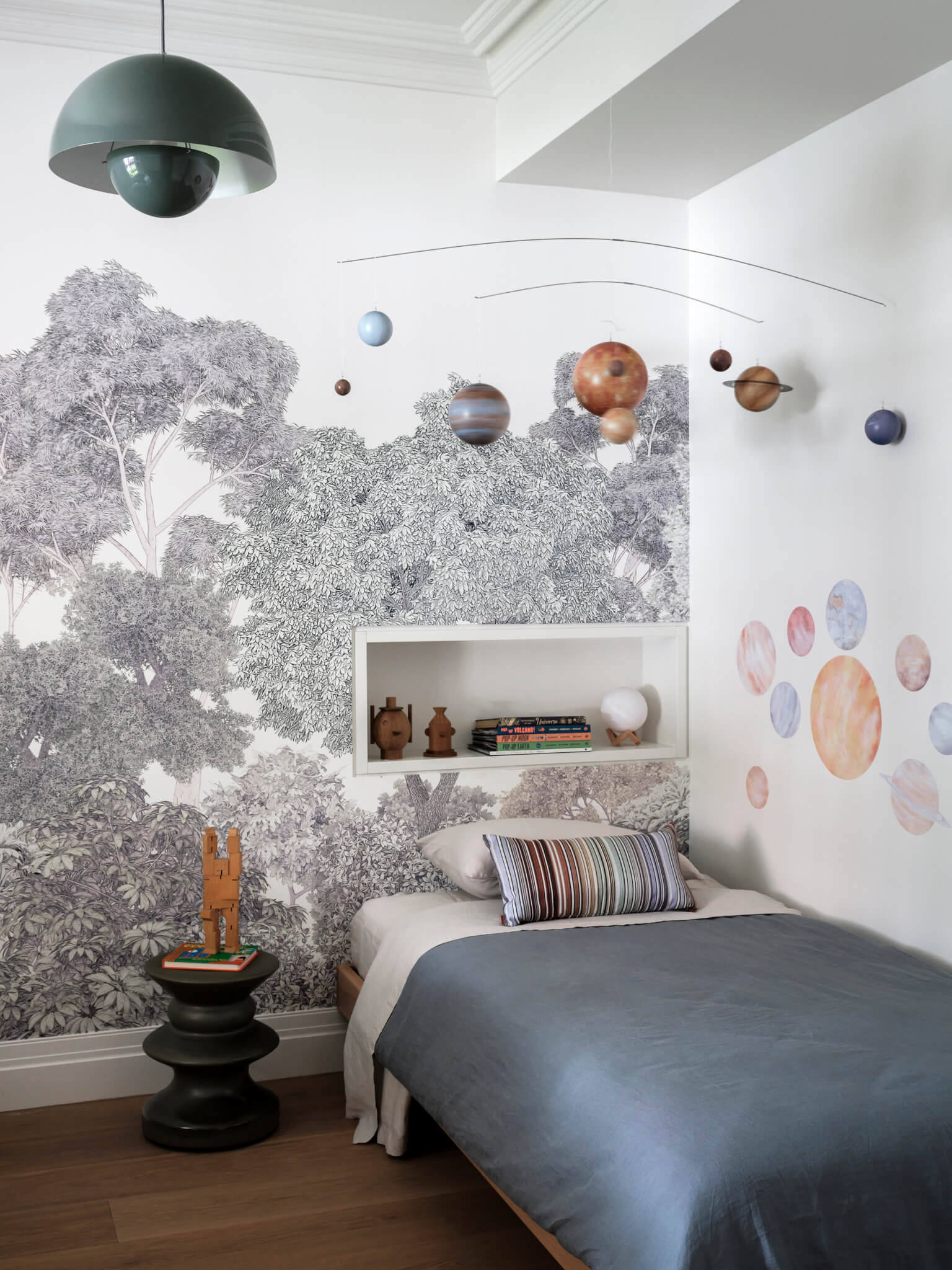 Bedroom wallpaper: tree, planets on the wall, white sheet, blue Quilt Cover Set, Black Side Table.