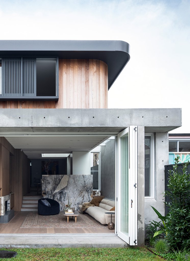 The external facade of Leichhardt House features timber and off-form concrete structure that is visible both inside and outside the building.